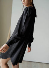 Long-sleeve pleated front A-line mini dress crafted from smooth silk fabric